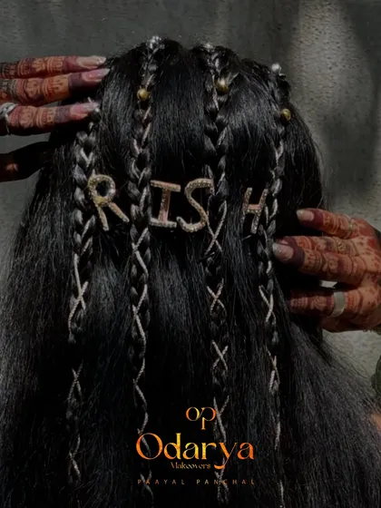 For the modern bride who wants something unique for her Haldi or Mehendi. This boho hairstyle with personalized name accents is a fun, creative way to make your pre-wedding look truly your own.