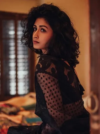This look, featuring a black lace saree, is all about subtle drama. I used a soft smoky eye and a natural lip to create a look that is both traditional and modern.