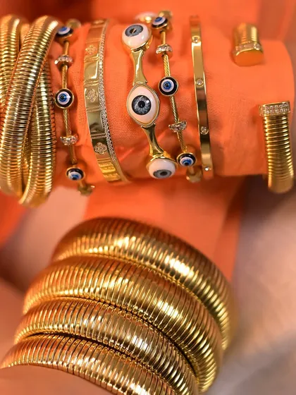 It's all about how you style it. This double-stacked look features my chunky snake bangles and classic evil eye pieces for a bold, maximalist vibe.