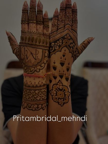 A unique design featuring the couple's initials 'V' and 'P' on one hand, and a pattern of hanging lamps on the other. I love creating asymmetrical designs that tell a story.