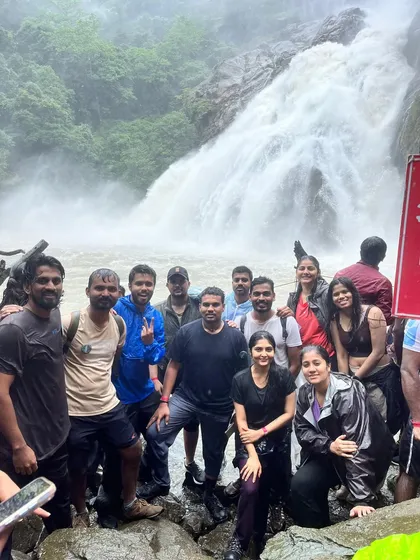 A close-up shot of our group right at the base of the powerful Dudhsagar falls, feeling the spray and energy.