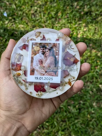 This 4-inch coaster was created as part of a set with a larger lamp. It features preserved red rose petals and a polaroid-style photo, making it a cute mini-keepsake.