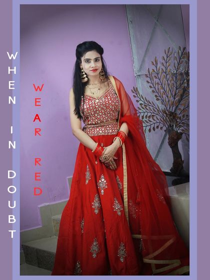 A fun shot with our red party-wear lehenga. It's a great rental option for festivals or wedding functions.