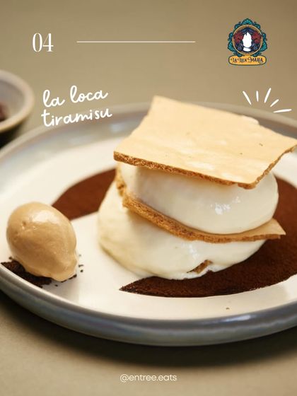 A deconstructed tiramisu, presented with artistic flair. This photo showcases a modern, gourmet take on the classic dessert, appealing to fine dining restaurants that want to highlight their culinary creativity.