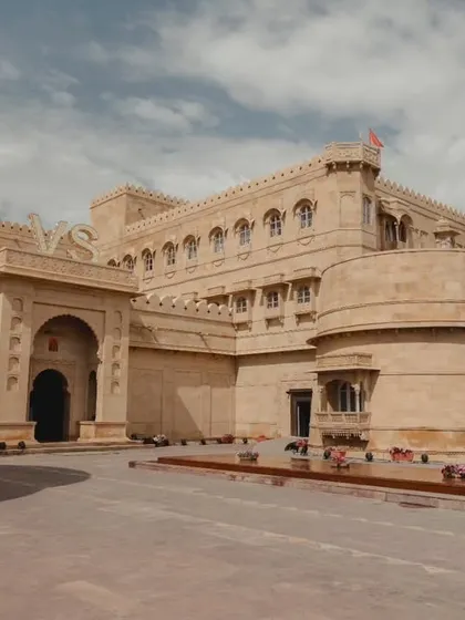 The grand facade of Suryagarh, Jaisalmer. Its imposing and beautiful architecture provides a sense of arrival and sets the tone for a regal and luxurious wedding experience from the very first moment.