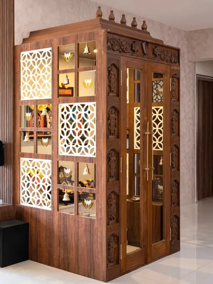 This puja unit is the spiritual heart of the home, designed with intricate, traditional craftsmanship. The teak wood frame features hand-carved Dashavatar motifs, creating a sacred space that is both grand and deeply personal.
