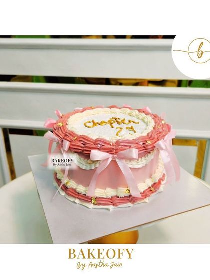 Another view of the vintage-style "Chapter 29" cake, showing the intricate piping work and delicate ribbon details.