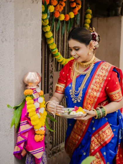 A full-length portrait capturing the complete festive look for Gudi Padwa. The model's elegant pose showcases her beautiful traditional saree and the decorated Gudi, creating a perfect festive memory.