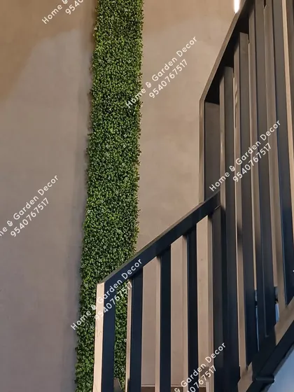 A simple strip of green can make a big impact. This minimalist vertical garden concept adds a clean line of nature along the staircase, enhancing the modern aesthetic of the home.