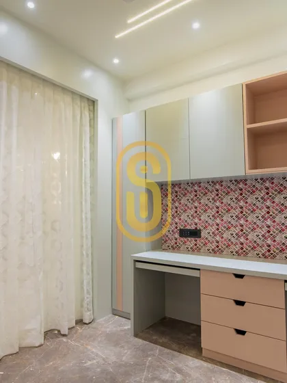 A 3D concept for a home office or study area for two. The design features a colorful mosaic backsplash and a mix of open and closed storage, creating a functional and cheerful workspace.