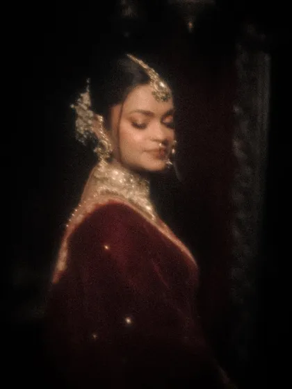 A soft-focus, dreamy portrait of a bride, giving the image a vintage, film-like quality.