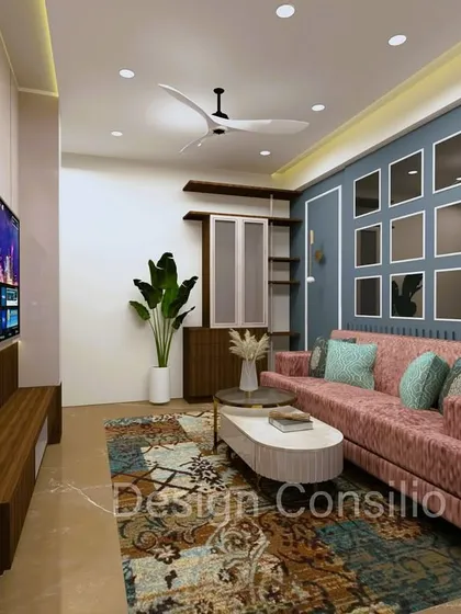 This view showcases the feature wall behind the sofa, which has a grid of decorative mirrors. This is a great technique we use to make a room feel larger and brighter.