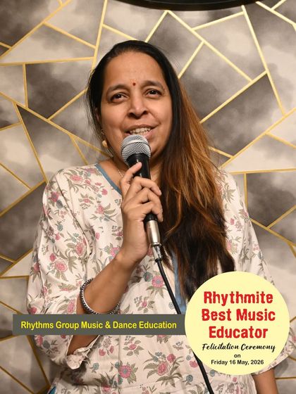 A candid photo of Ms. Netra Biwalkar during the felicitation ceremony, capturing her passion for music.