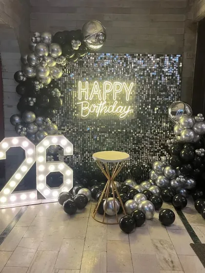 The sequin backdrop with a cake table, ready for the celebration.