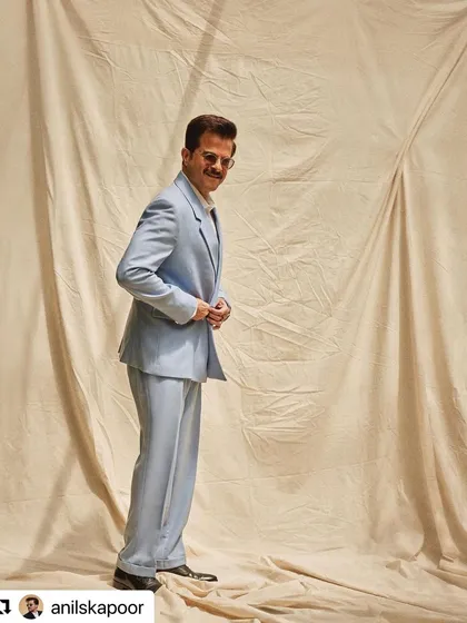 Another stylish look for Anil Kapoor during TIFF, this time in a powder blue suit. The hair is consistently sharp.
