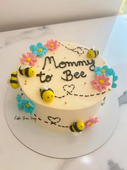 A little honey is on the way. A sweet "Mommy to Bee" cake, perfect for a baby shower.