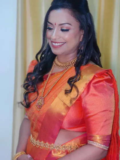 The makeup was designed to be soft and glowing, letting the richness of the silk saree and temple jewelry take center stage.