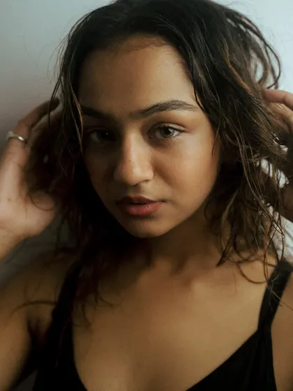A series of creative headshots using glass and other objects in front of the lens to create distortion and blur. This technique adds an artistic, abstract layer to the portraits.