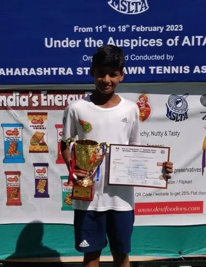 Rishikesh Mane with his prize at the U12 National Championship. Our program is structured to help players peak at these major AITA events.