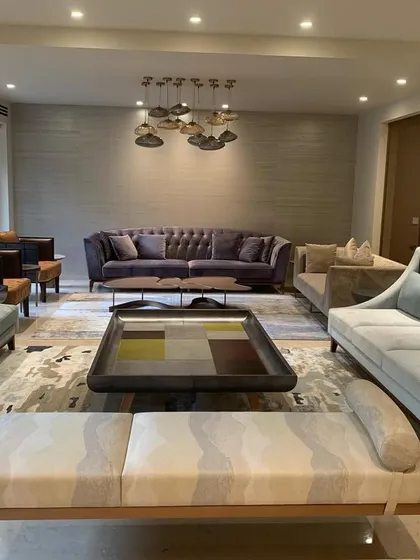 The living room of the renovated Delhi home, showing the serene and dreamy palette of powder blue, lilac, and ivory. The carefully selected furniture and soft colors create a palpable sense of serenity.