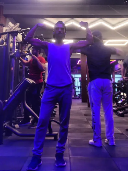 A post-workout pose. The gym is my sanctuary, where hard work translates directly into results.