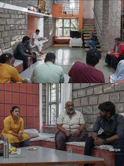 A gathering of family and friends in the main living area, which is designed with built-in seating to be a comfortable and communal space.