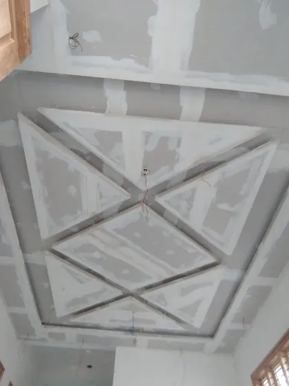 The raw structure of a geometric false ceiling design. This is the framework that will eventually become a stunning design feature.