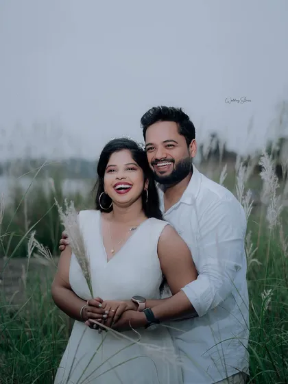 Pure, unrestrained laughter is the best. This candid shot captures a moment of genuine joy between the couple, making it a precious memory.
