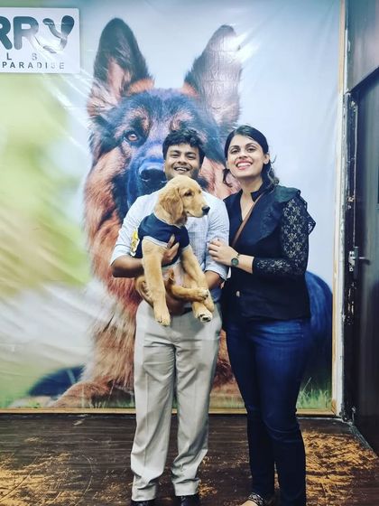 A happy couple with their Golden Retriever puppy, Joey, during his first boarding experience with us. We are honored to be trusted with your precious family members.