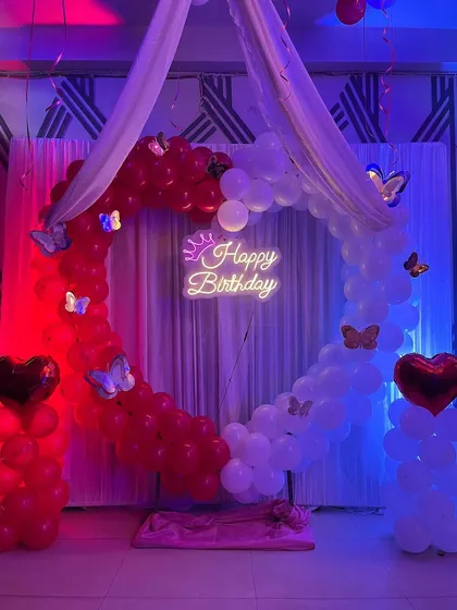 A straight-on view of the love-themed birthday decoration, perfect for a partner's surprise.