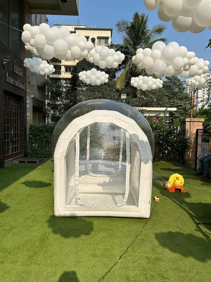 My transparent bubble house set up on an artificial lawn. It can be filled with balloons and is a huge hit for photos at any kids' party or event.