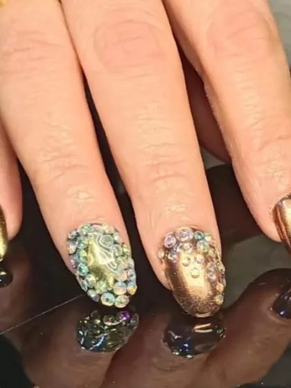 A close-up of the dazzling rhinestone-encrusted accent nails.