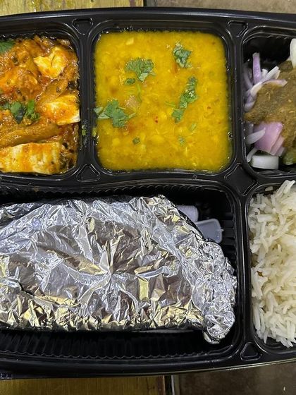 A customer favorite, the kadai paneer and dal thali. The paneer is cooked in a fragrant, spicy gravy that pairs perfectly with the simple dal.