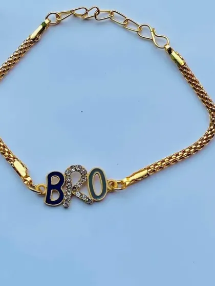 This "BRO" rakhi features multicolored enamel with a single sparkling stone, offering a more subtle yet stylish look.