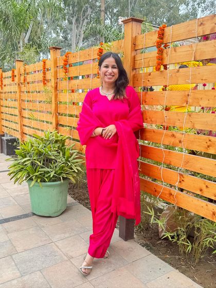 For a Haldi ceremony in Punjab, I styled myself in a vibrant fuschia pink suit instead of the traditional yellow. Paired with simple diamond jewelry, it was a fresh and modern take on bridesmaid attire.