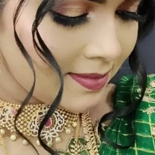 A close-up on the eye makeup, showing perfectly applied false lashes and blended eyeshadow, key skills for any professional makeup artist.