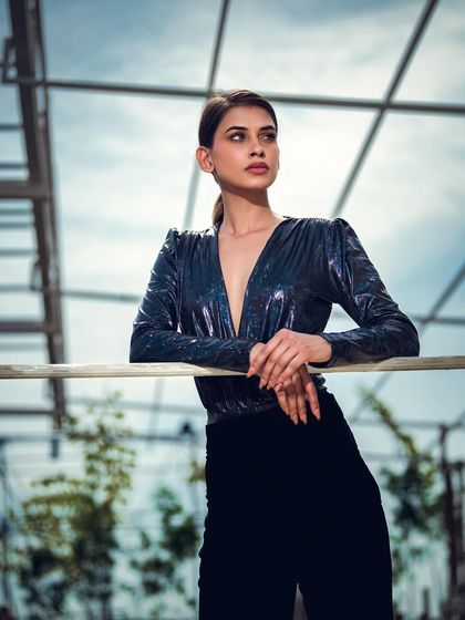 A punchy, high-contrast outdoor portrait. Even outside the studio, I use lighting techniques to create a dramatic, sculpted look that makes the subject stand out against the sky.