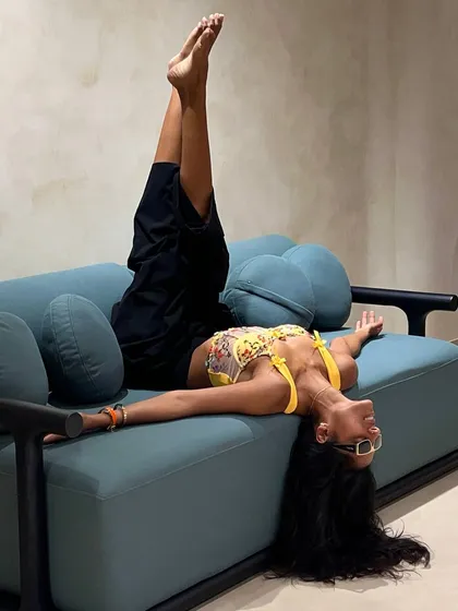 My furniture is designed to be lived in and loved. This shot of a client testing out our sofa perfectly captures the blend of style and pure comfort I aim for. It’s not just about looking good; it’s about feeling good in your space.