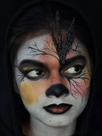 Another perspective of the gothic look, showing the subtle color variations in the face paint and the texture of the glitter applique.