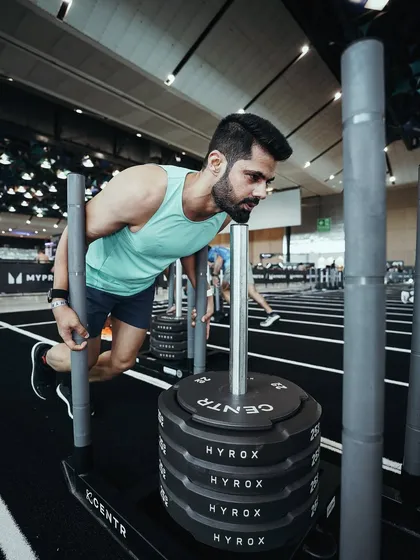 I apply the same scientific principles to my own training that I use with my clients. Pushing this sled at a Hyrox competition isn't just about physical strength; it's about understanding my body's genetic potential for power and endurance and using that knowledge to go beyond my perceived limits.