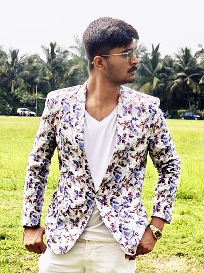 A closer look at the details of our popular floral print blazer. The pattern is modern and stylish, making it a favorite among our younger clients for college events and parties.