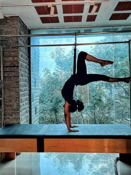 Physical fitness is the definition of wealth. This powerful handstand variation on the Cadillac is an investment in long term health.