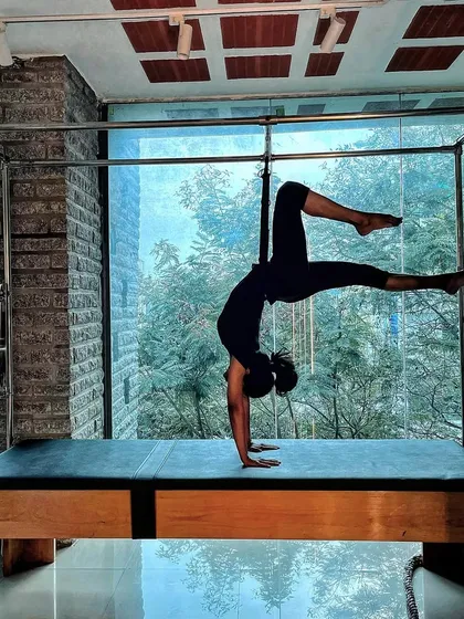Physical fitness is the definition of wealth. This powerful handstand variation on the Cadillac is an investment in long term health.