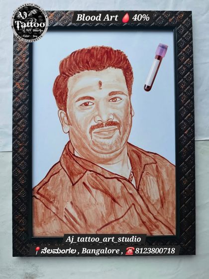 A hand-painted blood portrait of a man, capturing a warm and friendly expression. The vial of blood is shown alongside the art, connecting the medium to the final product.