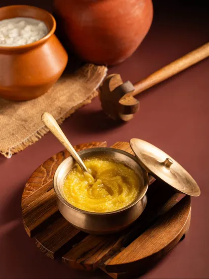 It’s all about setting the scene. We styled this shot for Aazol ghee with traditional earthenware and a wooden churner to evoke a sense of heritage and purity.