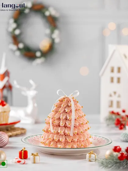 Our Christmas Tree Cake is a true showstopper. Made with Belgian chocolate and frosted in festive pink, it's adorned with golden sprinkles to make your celebration shine.