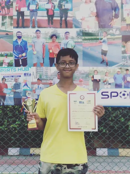 Riddhiman Ojha proudly displays his trophy and certificate after winning the Doubles title at a TS-7 tournament in Gurgaon for the Under-14 category.