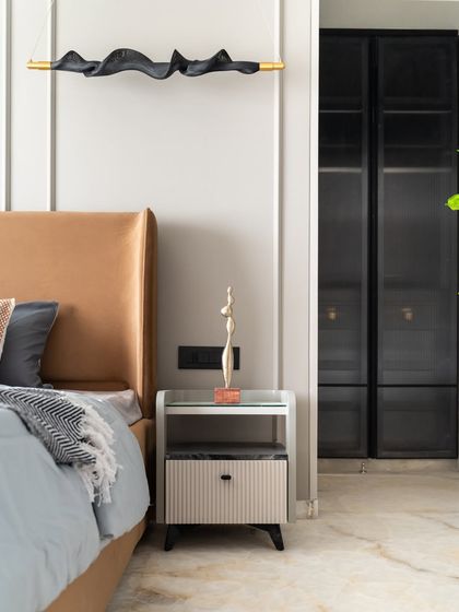 Soft sophistication meets sleek modernism in this bedroom. It features a plush suede bed for ultimate comfort, a chic PU-finish side table, and minimalistic profile shutters that complete the contemporary aesthetic.