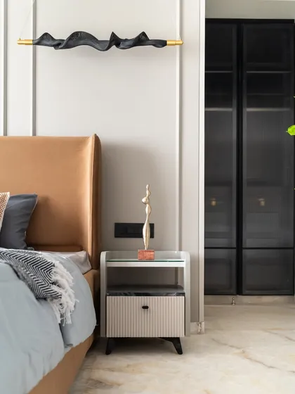 Soft sophistication meets sleek modernism in this bedroom. It features a plush suede bed for ultimate comfort, a chic PU-finish side table, and minimalistic profile shutters that complete the contemporary aesthetic.