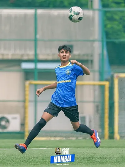 A player leaps into the air to control a high ball, demonstrating excellent technique and athleticism. This is what it looks like to not just play the game, but to live it.